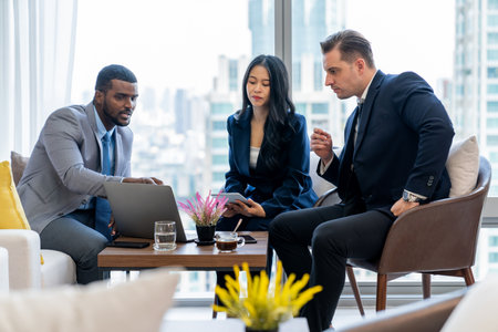 African businessman present start up project to expert investor. Group of multicultural business team solving problems, discussing business idea with skyscraper at modern business lounge. Ornamentedの写真素材