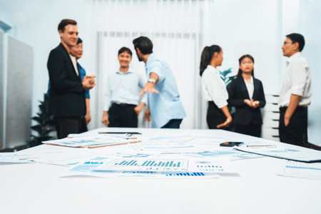 Business intelligence and analyzed financial data visualized on papers with blur background of analyst team utilizing BI Fintech in meeting room for business insight and marketing planning. Prudentの写真素材