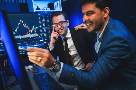 Two stock exchange traders discussing on dynamic successful investment graph, pointing trending of...