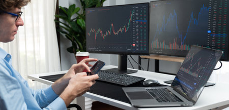 Young investor in stock trader looking on smartphone of dynamic financial exchange investment...