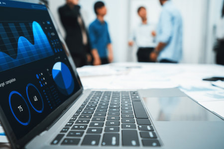 Analytic database by BI Fintech dashboard displayed on laptop for analyzed financial data on blur background with business people analyzing for insights power into business marketing planning.Prudentの写真素材