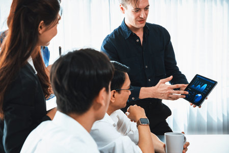 Data analysts team of office worker collaborate on business intelligence BI dashboard to analyze financial, trend, and marketing data. BI software utilization drive business success. Prudentの写真素材