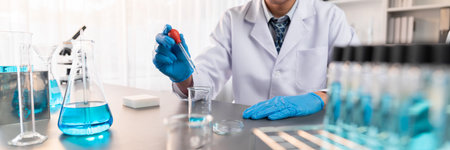 Scientist conduct chemical experiment in medical laboratory, carefully drop precise amount of liquid...