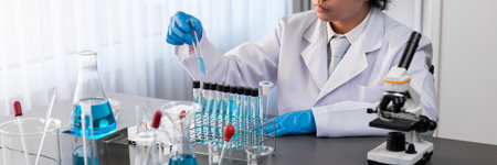 Scientist conduct chemical experiment in medical laboratory, carefully drop precise amount of liquid...