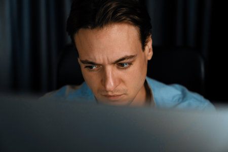 Stressful sales manager data analyzing on marketing analysis planning on pc monitor report at home...