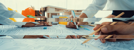 Worker, architect and engineer work on real estate construction project oratory planning with cartography and cadastral map of urban town area to guide to construction developer business plan of cityの写真素材