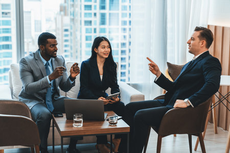 African businessman present start up project to expert investor. Group of multicultural business team solving problems, discussing business idea with skyscraper at modern business lounge. Ornamentedの写真素材