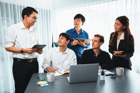 Group of diverse office worker employee working together on strategic business marketing planning in corporate office room. Positive teamwork in business workplace concept. Prudentの写真素材