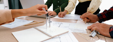 Skilled architect team using architectural equipment during colleague discussion about building...