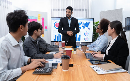 Businessman presenting data analysis dashboard display on TV screen in modern meeting for marketing strategy. Business presentation with group of business people in conference room. Concordの写真素材