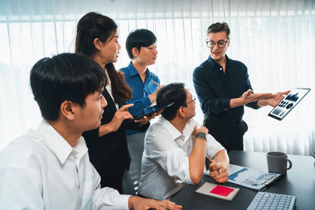 Data analysts team of office worker collaborate on business intelligence BI dashboard to analyze financial, trend, and marketing data using tablet. BI technology and data analysis concept. Prudentの写真素材
