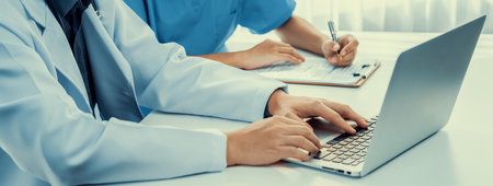 Professional various team of medical working and planning medical treatment at hospital table together. Teamwork lead to successful illness and sickness treatment. Panorama Rigidの写真素材