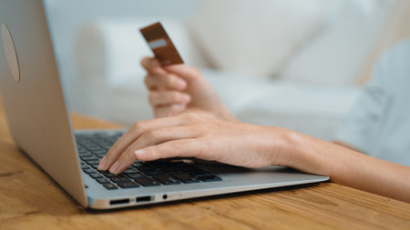 Woman shopping or pay online on internet marketplace browsing for sale items for modern lifestyle and use credit card for online payment from wallet protected by vivancy cyber security softwareの写真素材