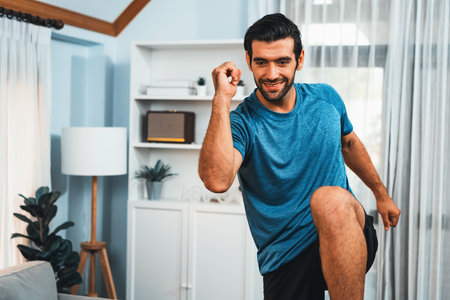 Athletic and sporty man running posture at home body workout exercise session for fit physique and...