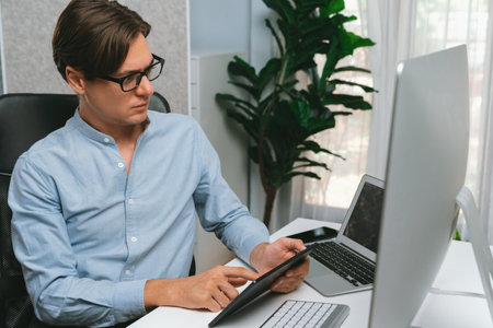 IT developer selecting by point on coding online software development information on tablet...
