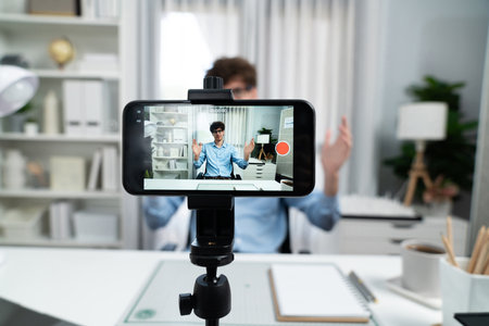 Host channel of influencer using smartphone focusing phone streaming online broadcast in sales and...