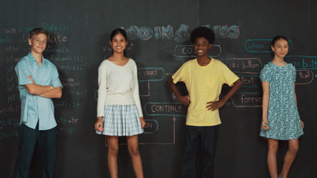 Multicultural people pose at camera while standing with confident. Diverse high school children crossing arm or posing to camera at blackboard with prompt or coding plan at STEM class. Edification.の写真素材