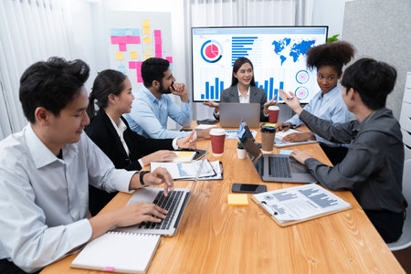 Young asian businesswoman presenting data analysis dashboard on TV screen in modern meeting. Business presentation with group of business people in conference room. Concordの写真素材