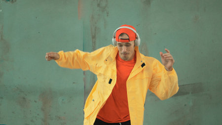 Closeup image of caucasian hipster shows or practicing footstep at street, urban city. Motion shot...