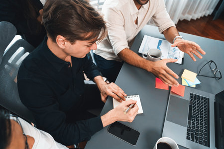 Group of diverse office worker employee working together on strategic business marketing planning in corporate office room. Positive teamwork in business workplace concept. Prudentの写真素材