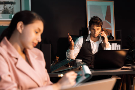 Focusing businessman calling with customer for creative business project planning at back view at...
