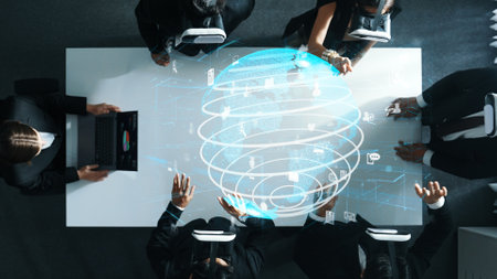 Professional business people wearing VR glass while working by using metadata in virtual world with hologram of big data. Communication technology or software development concept. Directorate.の写真素材