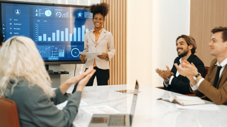 Diverse group of office worker and employee applauding, happy collaborate on strategic business marketing planning. Teamwork and positive attitude create productive and supportive in ornamented officeの写真素材