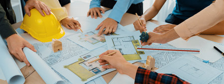 Professional architect cooperate with engineer discussing the use of green design in eco house...