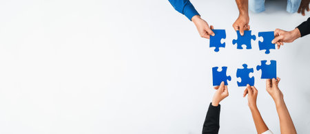 Top view panorama banner of business team joining jigsaw puzzle together over meeting table symbolize business partnership and collective unity teamwork in problem solving solution. Prudentの写真素材