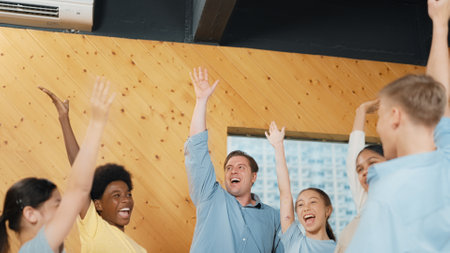Caucasian teacher and smart diverse highschool student in casual cloth raised hands for voting, asking, answering, volunteering in group therapy at classroom. Creative education concept. Edification.の写真素材