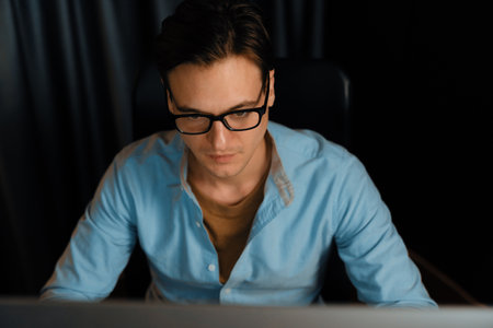 Thinking of stressful financial analyst researching on business paragraph on pc screen with dynamic...
