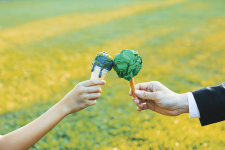 Businessman exchange tree to a boy holding melting Earth as part of ESG and CSR initiative concept...