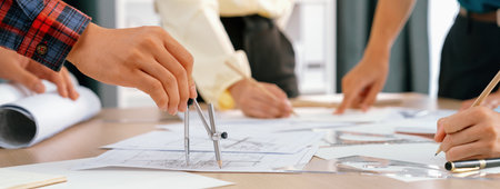 Skilled architect engineer team discuss about architectural project while project manager using...