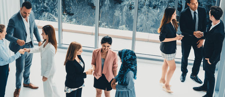Many business people gathering in modern office building for business conference in the city. Businessmen and businesswomen communication and human resources concept. udsの写真素材