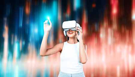 Female stand wear white VR headset and sleeveless connecting metaverse, future technology,...