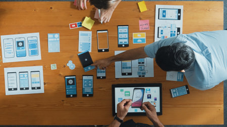 Top view of smart Ui designer brainstorming and planning about Ux Uo design or mobile interface...