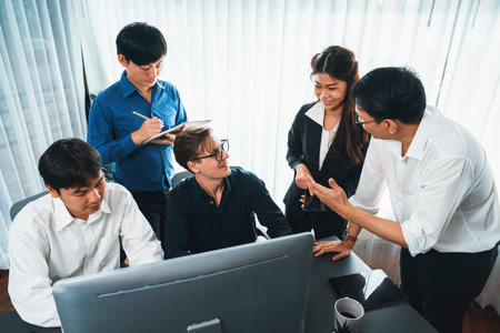 Group of diverse office worker employee working together on strategic business marketing planning in corporate office room. Positive teamwork in business workplace concept. Prudentの写真素材