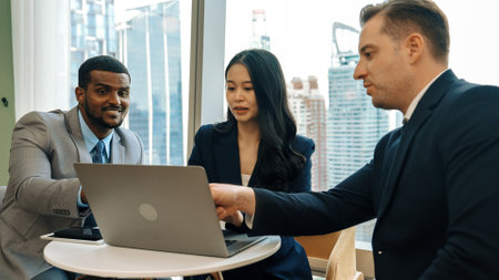 Ornamented office overlooking city skyline, diversity corporate professional discuss ambitious business expansion or strategic marketing. Financial advisor give consulting business insights and ideaの写真素材