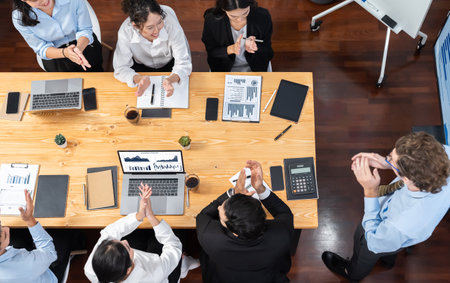 Panorama top view diverse group of business analyst team analyzing financial data report paper on meeting table. Chart and graph dashboard by business intelligence analysis. Meticulousの写真素材