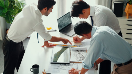 Top view of professional architect engineer team writing sticky notes and sticking note at meeting table while interior designer talking and discussing about building exterior designing. Alimentation.の写真素材