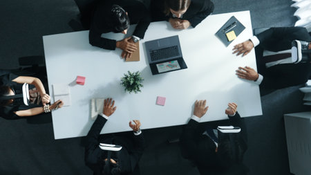 Top view of smart manager give vr head set to businesspeople while businesswoman prepare data...