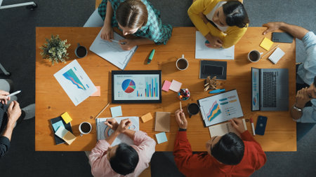 Top view of smart businessman present marketing idea at meeting while group of investor listening...