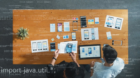 Top view of skilled business team looking at wireframe prototype with holographic of coding engineering prompt. Manager working together to design Ux Ui designing with programing system. Convocation.の写真素材