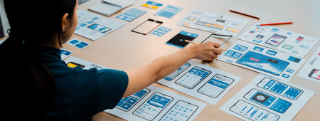 Panorama banner of startup company employee planning on user interface prototype for mobile...