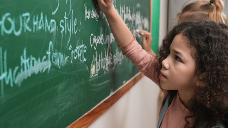 American student studying coding engineering prompt while writing answer on blackboard. Intelligence...