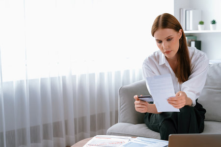 Stressed young woman has financial problems with credit card debt to pay utmost show concept of bad personal money and mortgage pay management crisis.の写真素材