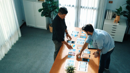 Top view of front-end developer design Ux Ui design for mobile phone interface with multicultural...