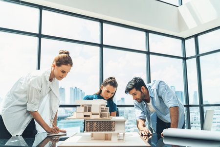 Professional diverse architect engineer team working together to design house model. Group of successful business team discussing and brainstorming about house structure. Civil engineering. Tracery.の写真素材