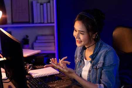 Host channel Asian influencer talking in broadcast streaming online wearing headsets on social media...