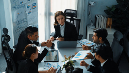 Top view of skilled team working together at meeting. Manager looking at financial document while making decision to invest in stock market. smart group analyze business data. Time lapse. Directorate.の写真素材